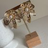 Boucle d’oreille feuille perlée