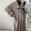 Manteau long en laine taupe- Élégance intemporelle et chaleur raffinée