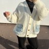 Gilet oversize en maille beige avec poches en jean – look casual et tendance