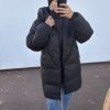 Doudoune longue noire – chaleur et style urbain