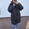 Doudoune longue noire – chaleur et style urbain