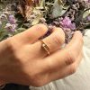 img_7136 Bague en acier inoxydable doré – design clou serti de strass