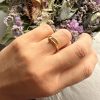 img_7137 Bague en acier inoxydable doré – design clou serti de strass