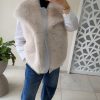 Gilet sans manches en fausse fourrure beige